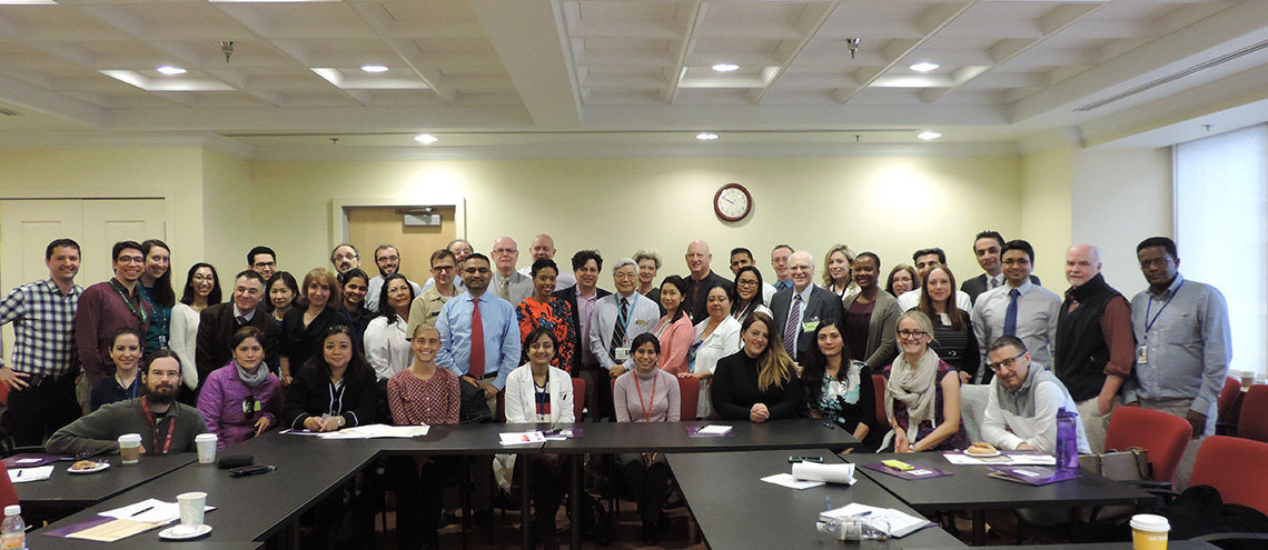 Lupus researchers pose together in conference room.