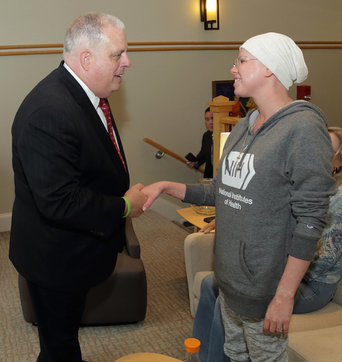 Hogan shakes hands with young patient