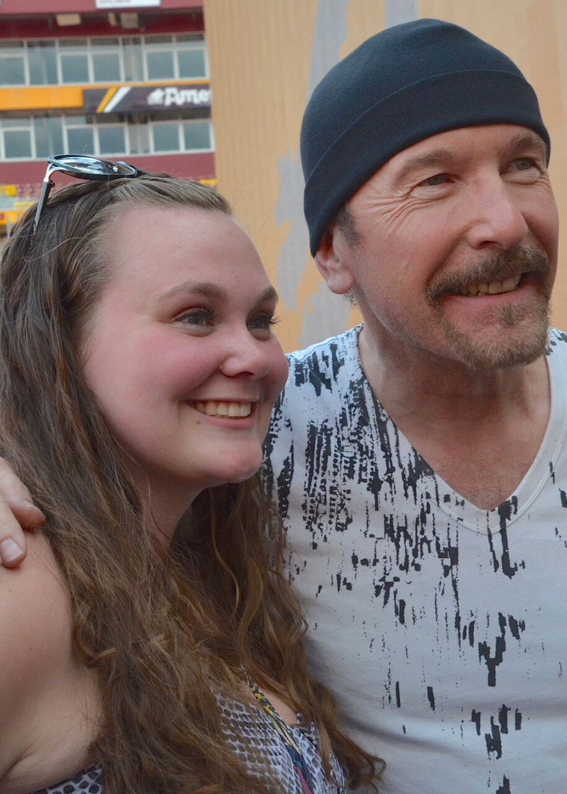 The Edge and Lee smile