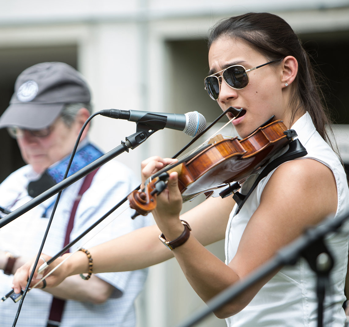 Cassie Parks plays violin outside the Clinical Center