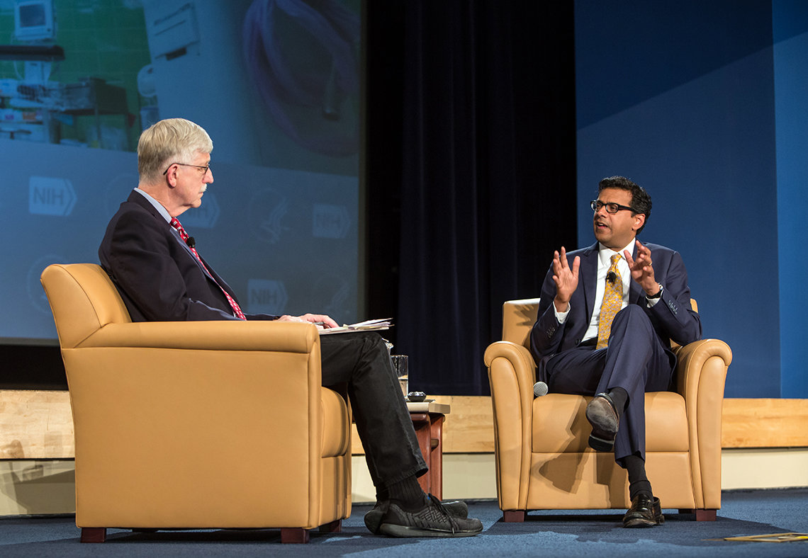 Gawande talks with Collins, seated on stage in Masur Auditorium.