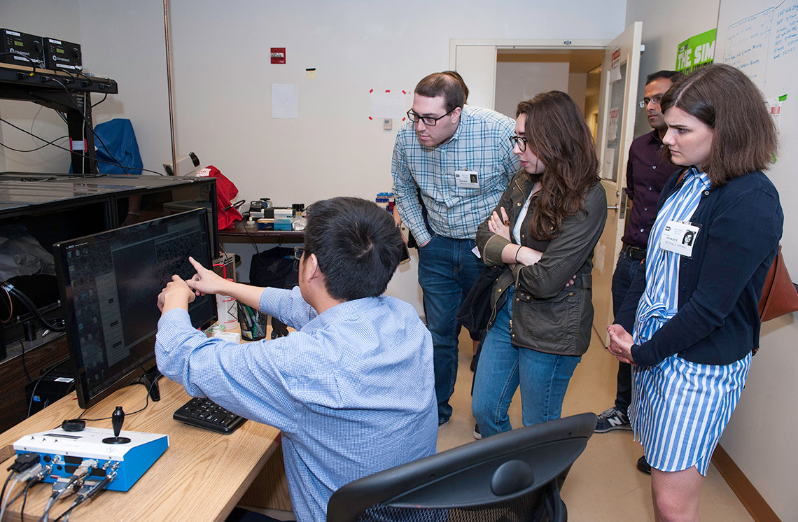 Staffers gather in NIBIB’s high resolution optical imaging lab.