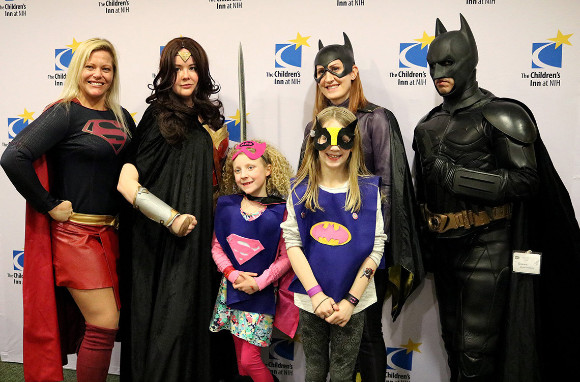 The Kerr sisters pose with heroes from Foundation 4 Heroes.