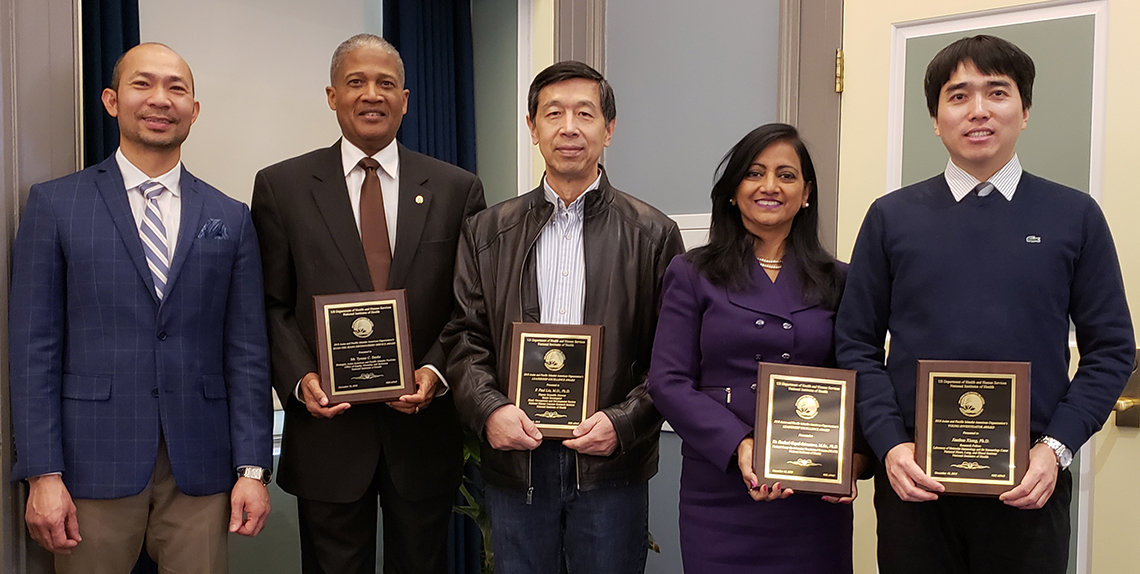 APAO awardees pose with their plaques