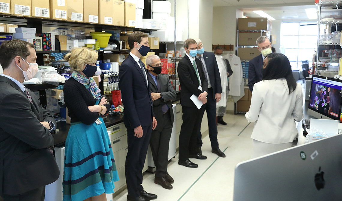 Several people stand in a lab