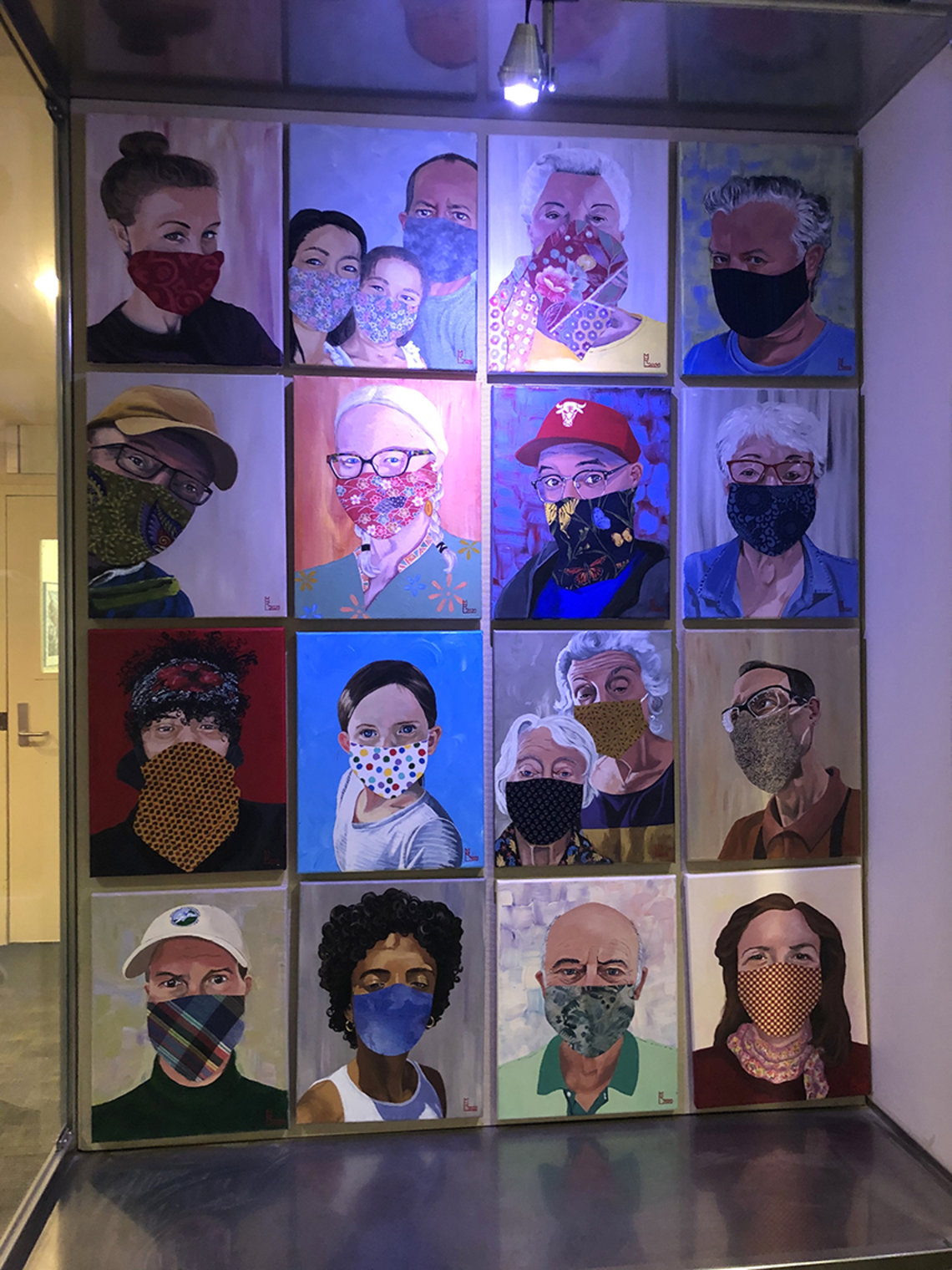 Paintings of people wearing face masks on display at Clinical Center