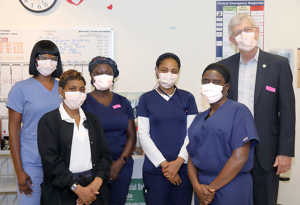 Collins poses with a group of staff members in the Clinical Center.
