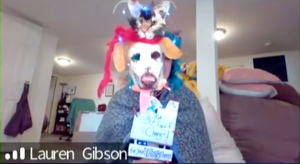 Gibson models her mask depicting a dog and cat