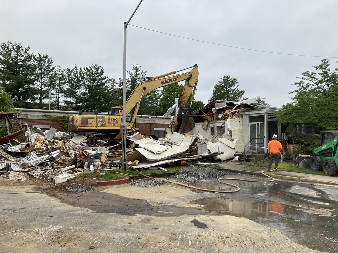 A demolition truck crushes bldg. 18.