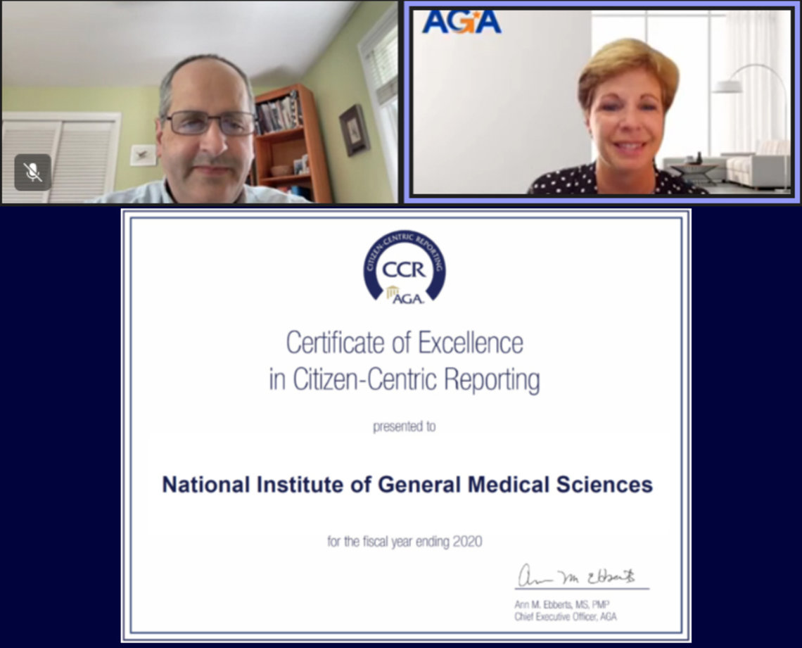 Screenshot of NIGMS Director Dr. Jon Lorsch and AGA Chief Executive Officer Ann M. Ebberts at a virtual ceremony, including an image of an award reading “Certificate of Excellence in Citizen-Centric Reporting presented to National Institute of General Medical Sciences for the fiscal year ending 2020.”