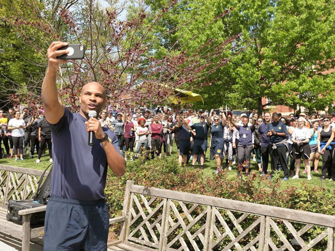 Adams takes a selfie in front of a large crowd 