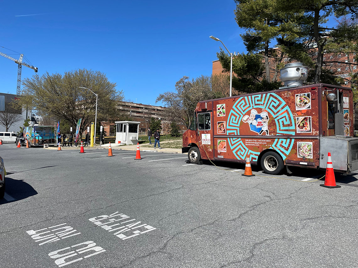 A food truck idles in a parking lot
