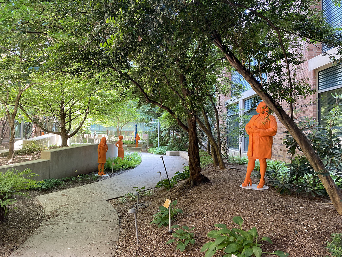 Orange statues in a courtyard