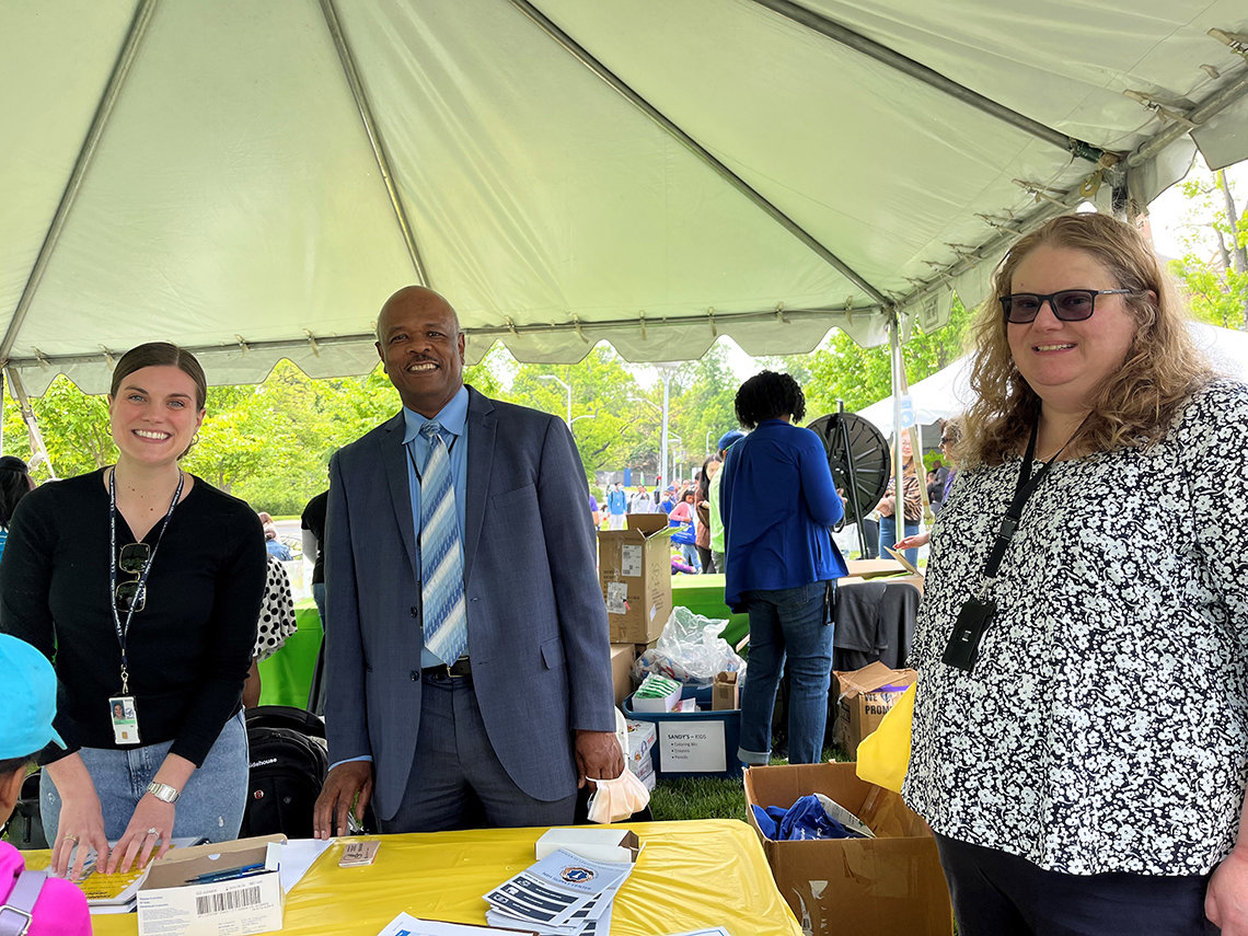 Dr. Alfred Johnson visits the supply center tent.
