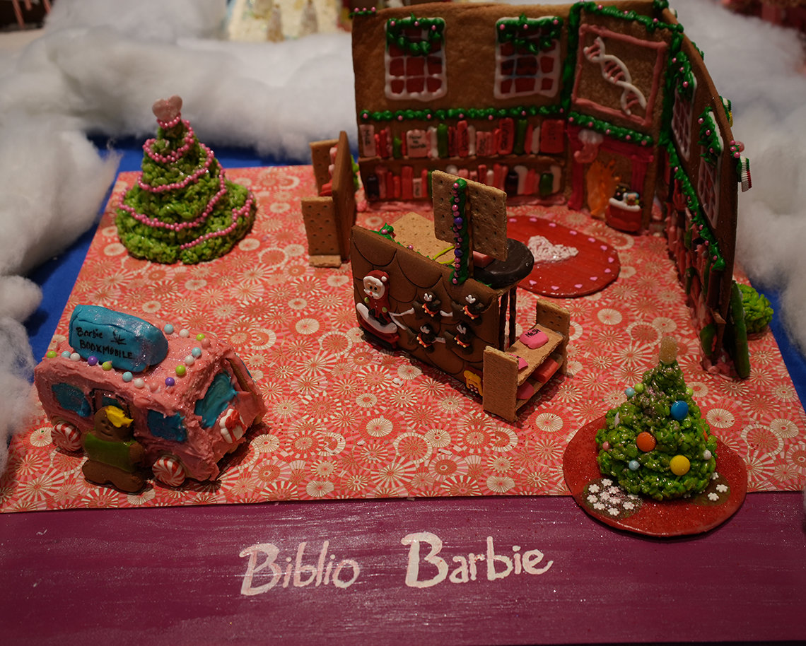 Barbie's house with a Christmas tree and a Barbie 'Bookmobile' van