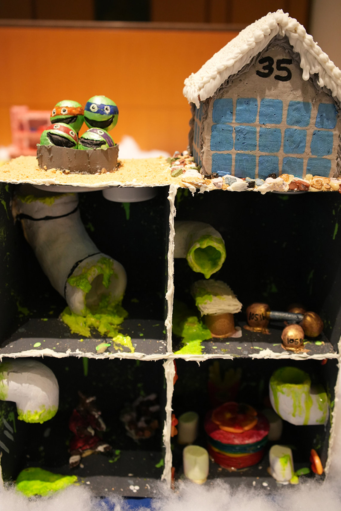 Goop from pipes, Ninja turtle heads and a Bldg. 35 gingerbread house on top