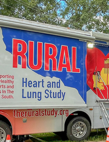 A long mobile van with a painted red heart and reads Rural Heart and Lung Study, Supporting Healthy Hearts and Lungs in the Rural South