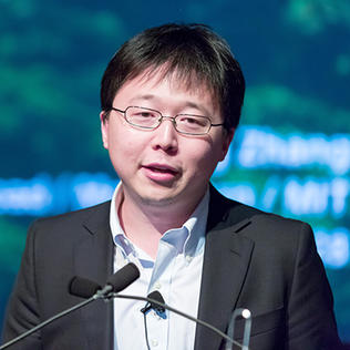 Zhang at microphone
