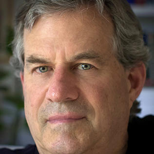 A head shot of Sam Quinones, with serious expression
