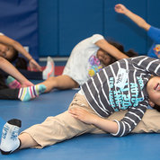 Kids stretch after a PiYo class in the NIH Fitness Center. PHOTO: CHIA-CHI CHARLIE CHANG