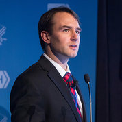 Dr. Andrew Demidowich lectures at an NIH podium