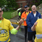2018 Carl Henn Award winner Dr. Vernon Anderson (l) accepts the trophy for years of cycling advocacy as BTWD enthusiasts (from l) Collins, Joe Cox, chief of ORS transportation services, and NLM’s Dr. Valerie Virta, BTWD co-organizer, look on. PHOTO: GERALD JORDAN