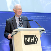 Porter standing at NIH podium