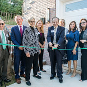 Cutting the ribbon at the newly dedicated scholar house are (from l) NIH distinguished investigator Dr. Michael Lenardo, NIH OxCam cofounder; Stephen McLean, IBRA founding member and chair; Dr. Barbara Alving, FAES board chair and NIH alumna; Dr. Tara Schwetz, NIH acting principal deputy director; Dr. Ralph Korpman, executive vice president and chief scientific officer of UnitedHealth Group and IBRA director; Nancy El-Hibri, wife of the late IBRA founding director Fuad El-Hibri; Randi Balletta, IBRA president; and Christina Farias, FAES CEO and executive director. PHOTO: BETH CALDWELL/BETH CALDWELL PHOTOGRAPHY