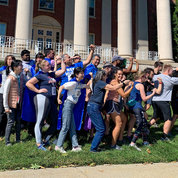 NEI Strong! Competitors and cheerleaders from several NEI teams, including House of the TH17, House of Vision and perennial favorite Wurtz Possible Runners, strike a pose on the front lawn of Bldg. 1. PHOTO: DUSTIN HAYS