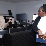 ORS Director Colleen McGowan (l) with Bonita Farrier in the Emergency Communications Center. PHOTO: CHIA-CHI CHARLIE CHANG.
