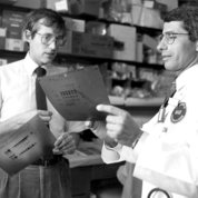 Fauci called Lane his “professional soulmate and chief confidant.” Above, the two consult on HIV data in the lab back in the day (circa 1987). 