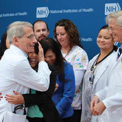 In 2014 outside the hospital, Fauci (l) and Lane (r) celebrate the successful treatment of Nina Pham, a nurse who recovered from Ebola. PHOTO: ERNIE BRANSON