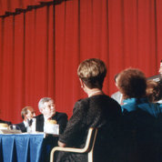 In Masur Auditorium, Fauci gives a briefing on HIV/AIDS for President Ronald Reagan (l) in 1987.