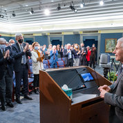 Dr. Anthony Fauci (r) receives a standing ovation as he bids farewell after more than 50 years at NIH. PHOTO: LESLIE KOSSOFF