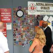 NIH leaders visit the badge wall. PHOTO: CHIA-CHI CHARLIE CHANG