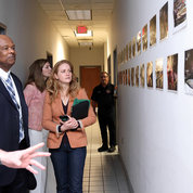 Johnson (l), McGowan and Schwetz view photos upstairs near the bunk rooms. PHOTO: CHIA-CHI CHARLIE CHANG
