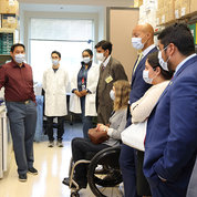 With Dr. Naomi Taylor’s group, fellows get a lab tour with (from l) Dr. Christopher Chien; Justin Mirazee, a Ph.D. student in the NIH-Johns Hopkins University Graduate Partnership Program; and Dr. Victoria Giordani, a pediatric oncology fellow in the program. PHOTO: Chia-Chi Charlie Chang