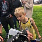 At his first TYCTWD, Calvin—son of Rebecca Lenzi of NIAMS—checks out a snake up close. PHOTO: Rebecca Lenzi.