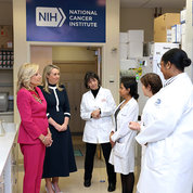 Shown at NIH (from l), First Lady Dr. Jill Biden; Jodie Haydon, partner of the Prime Minister of Australia; and Dr. Monica Bertagnolli, director of the National Cancer Institute (NCI) participate Oct. 25 in a briefing in an NCI Pediatric Oncology Branch (POB) laboratory with Dr. Nirali Shah, head of POB’s hematological malignancies section; Dr. Naomi Taylor, POB senior investigator; and Dr. Victoria Giordani, a clinical fellow in the Johns Hopkins-NIH Pediatric Hematology and Oncology Fellowship Program. PHOTO: CHIA-CHI CHARLIE CHANG