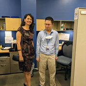 Wolek meets with David Han, a 2016 Project SEARCH NIH graduate who has worked with NIH Medical Records in the Health Information Management Division for eight years. PHOTO: Erin Bryant/NINDS