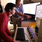 Mark Leschinsky (l) works a microscope in the laboratory under the direction of Dr. Robert Fariss, chief of the NEI- Biological Imaging Core Facility.