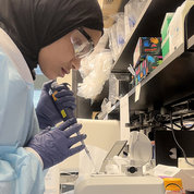 Muhammed in the lab, using pipette