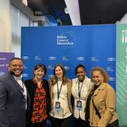 In front of the Cancer Moonshot booth are (from l) Dr. Marvin Langston of Stanford University; Bertagnolli; Dr. Laurie McLouth of the University of Kentucky; Dr. Leeya Pinder of the University of Cincinnati; and Dr. Sanya A. Springfield, director of the NCI Center to Reduce Cancer Health Disparities.