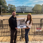 Shayne Frebert (l) and Kristy Derr of NCATS in front of the White House with the 3-D tissue bioprinter.